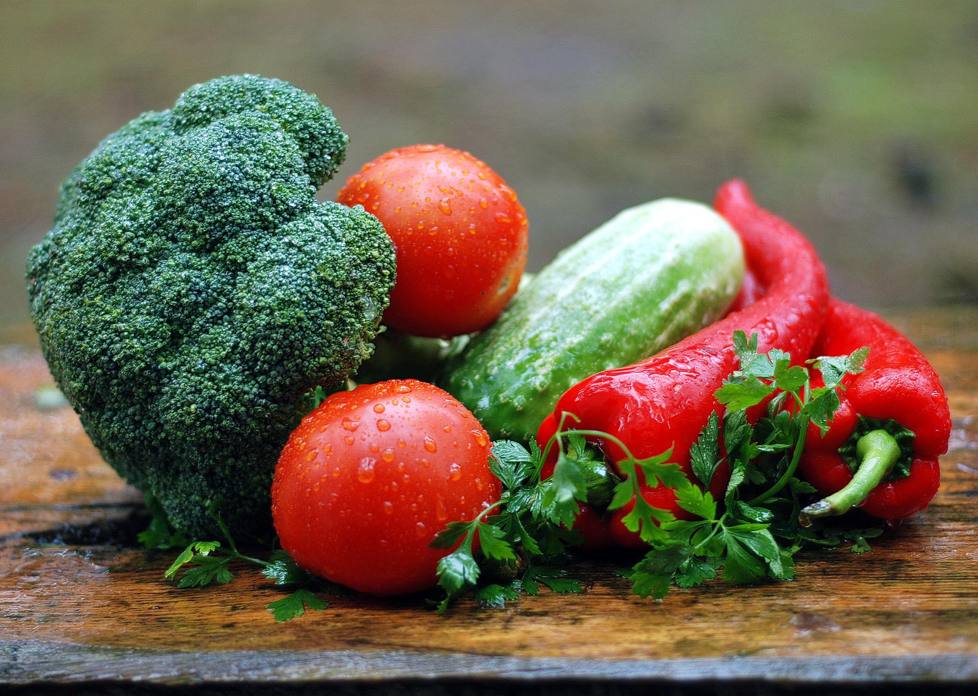 Fresh Green and Red vegetables on a table.